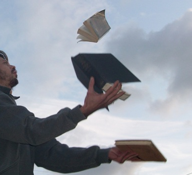 Picture of man juggling books